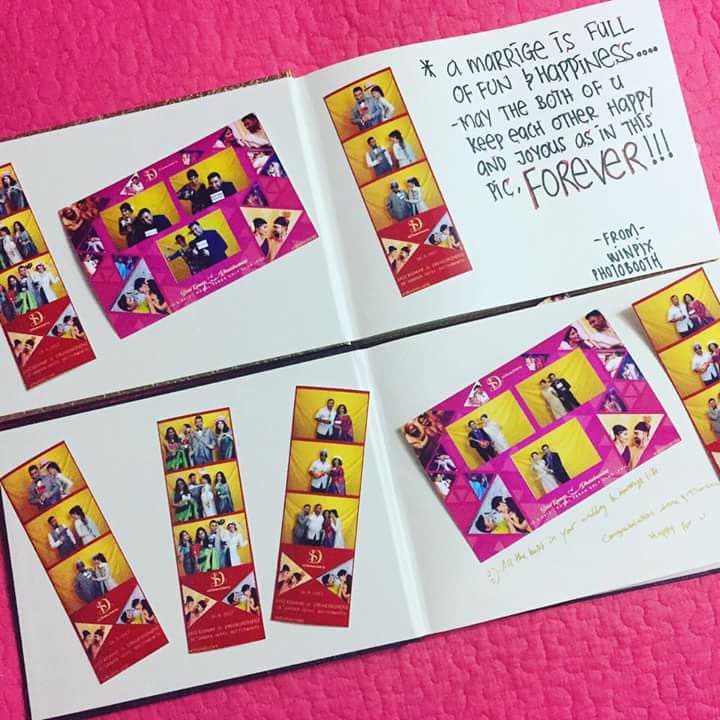 Open photo booth guest book with printed pictures and handwritten messages
